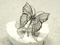 Perfect titanium casting of a filigree butterfly 